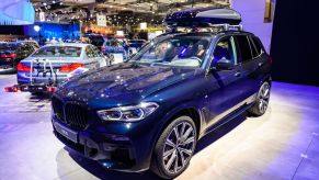 A dark blue 2021 BMW X5 SUV on display