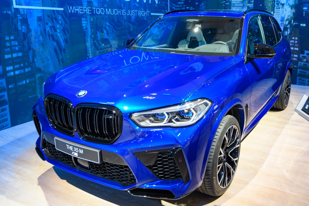 A blue BMW X5 M on display