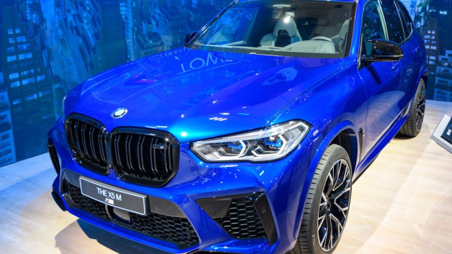 A blue BMW X5 M on display