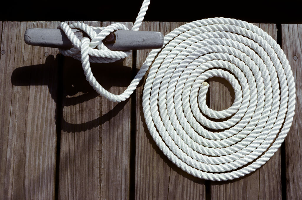 Two of the most basic boating accessories, a coil of rope and a tie-off