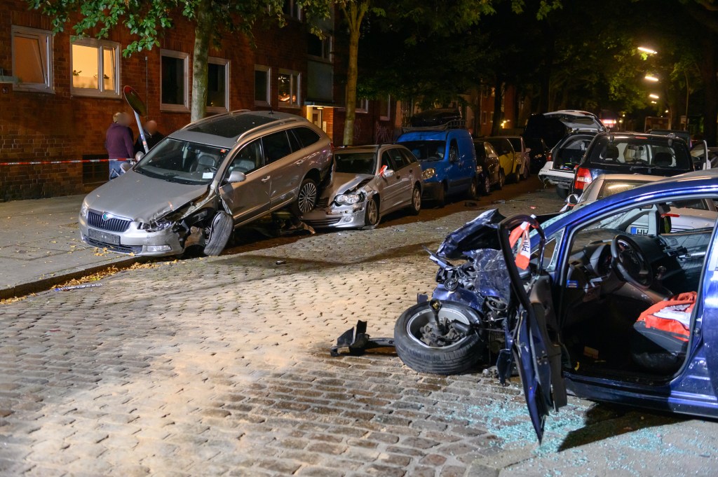 A car accident shows several wrecked cars on a residential street in Germany. 2020 showed a major up tick in fatal car crashes and Zoom Zombies may be to blame