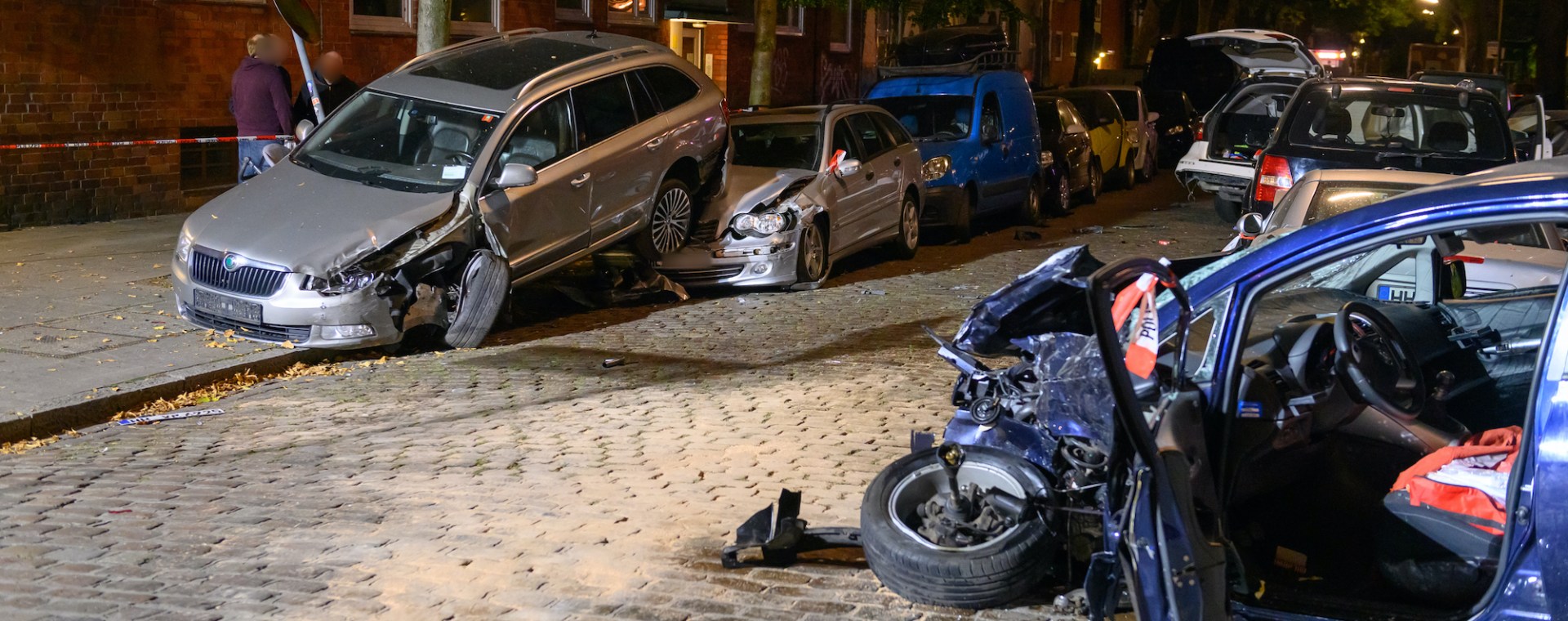 A car accident shows several wrecked cars