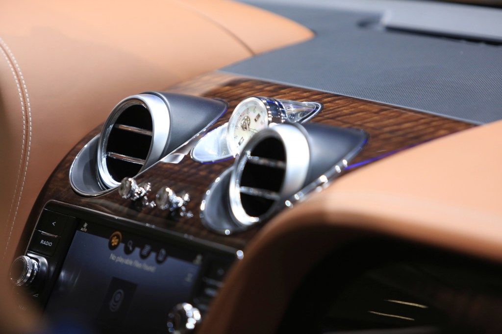 Air conditioning vents sit on the dashboard of a Bentley Bentayga SUV automobile.