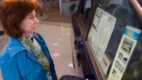 A customer inspects the window sticker of a 2011 Toyota Sienna at Fred Anderson Toyota in Raleigh, North Carolina