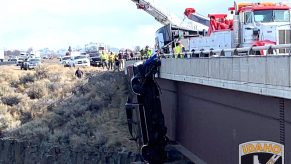 Ford F-350 dangling over bridge