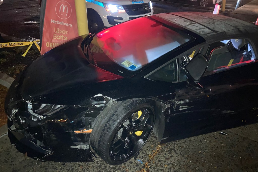 An image of a crashed Lamborghini Huracán Spyder outside of McDonald's.