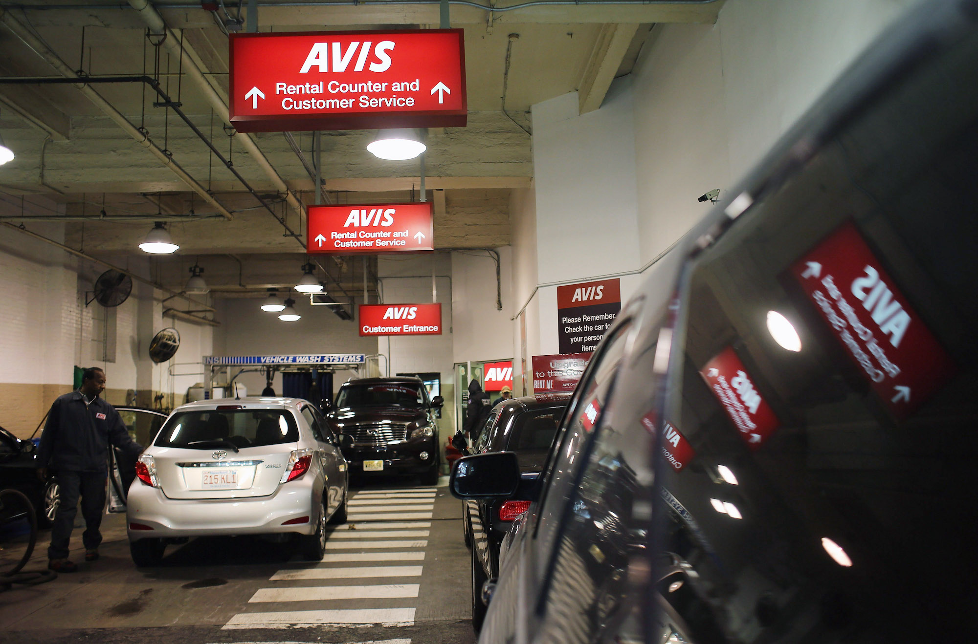 Red signs mark an Avis rental car branch in Manhattan on January 2, 2013, in New York City.