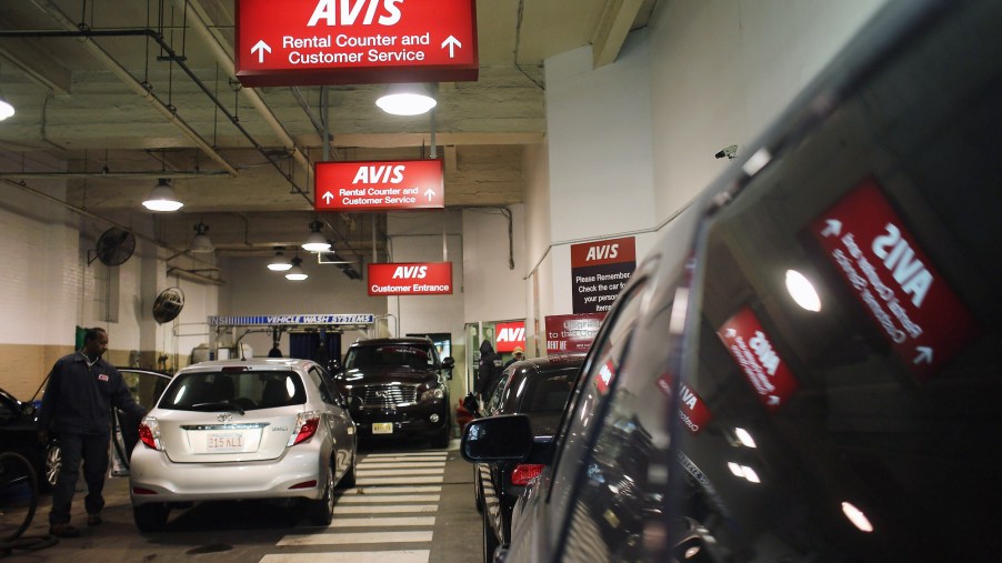 Red signs mark an Avis rental car branch in Manhattan on January 2, 2013, in New York City.