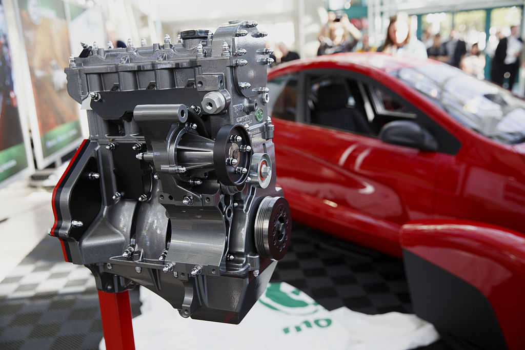 A three-cylinder engine on display at an auto show