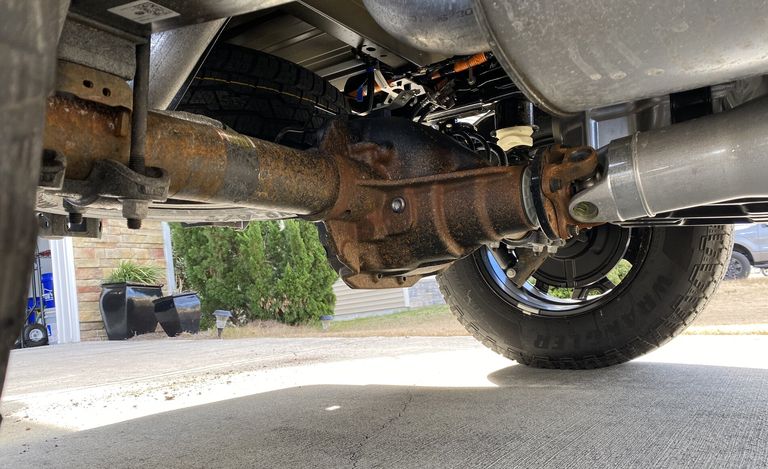 A 2021 Ford F-150 back axle covered in rust.