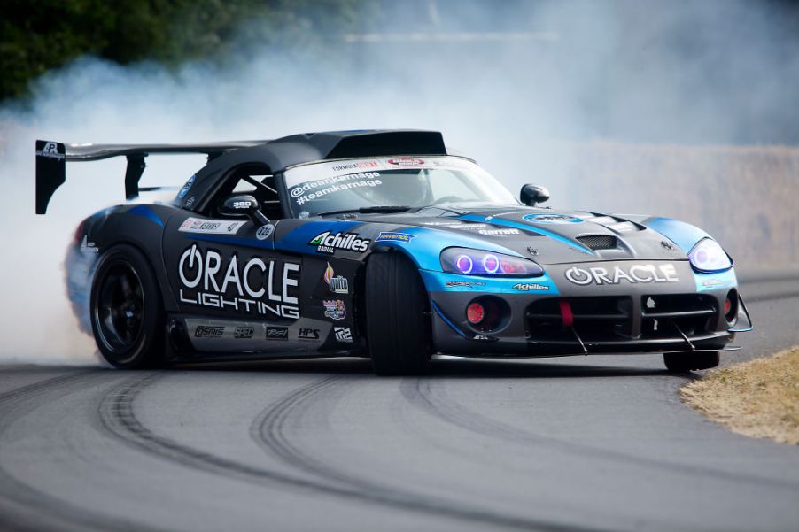 A dodge viper taking a hard corner around a track