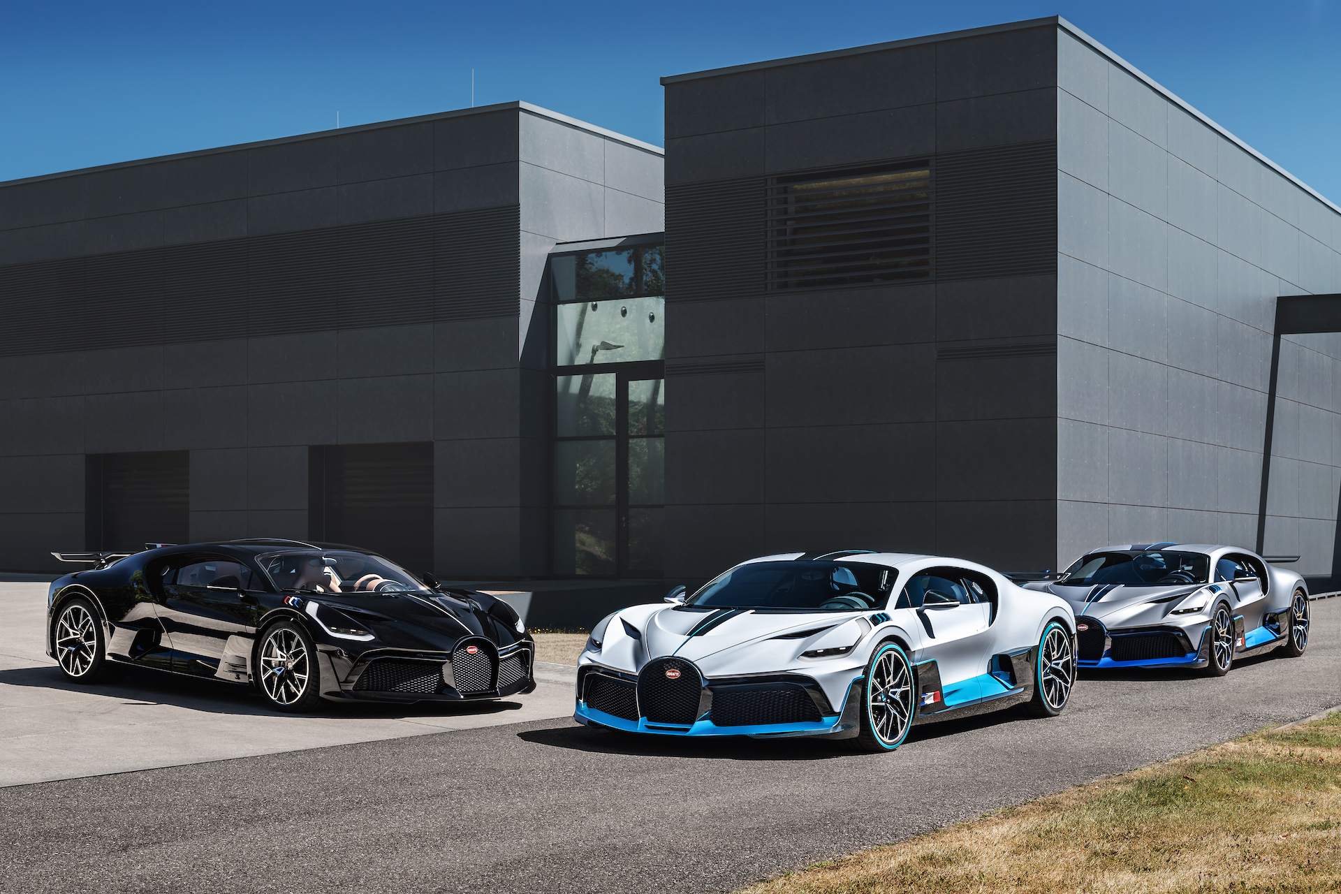 An image of a few Bugatti Divo models parked outside.