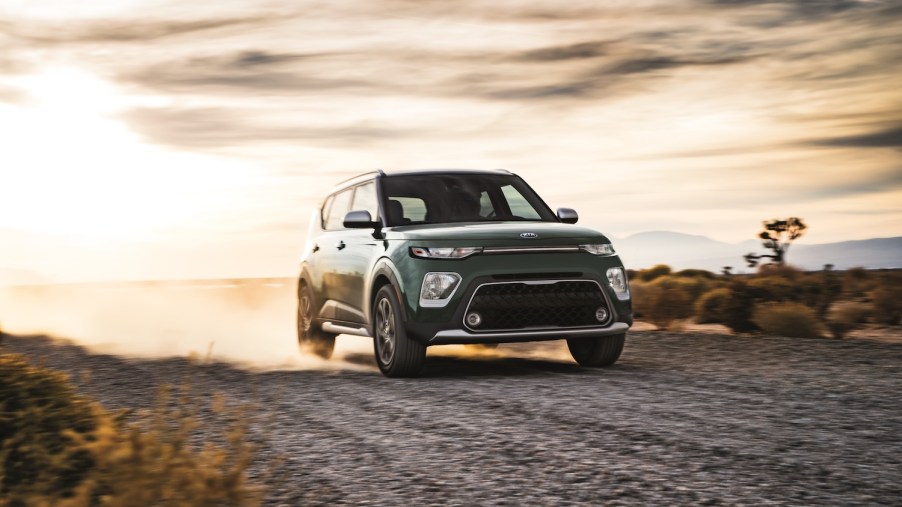 The recently recalled 2021 Kia Soul driving on a gravel road