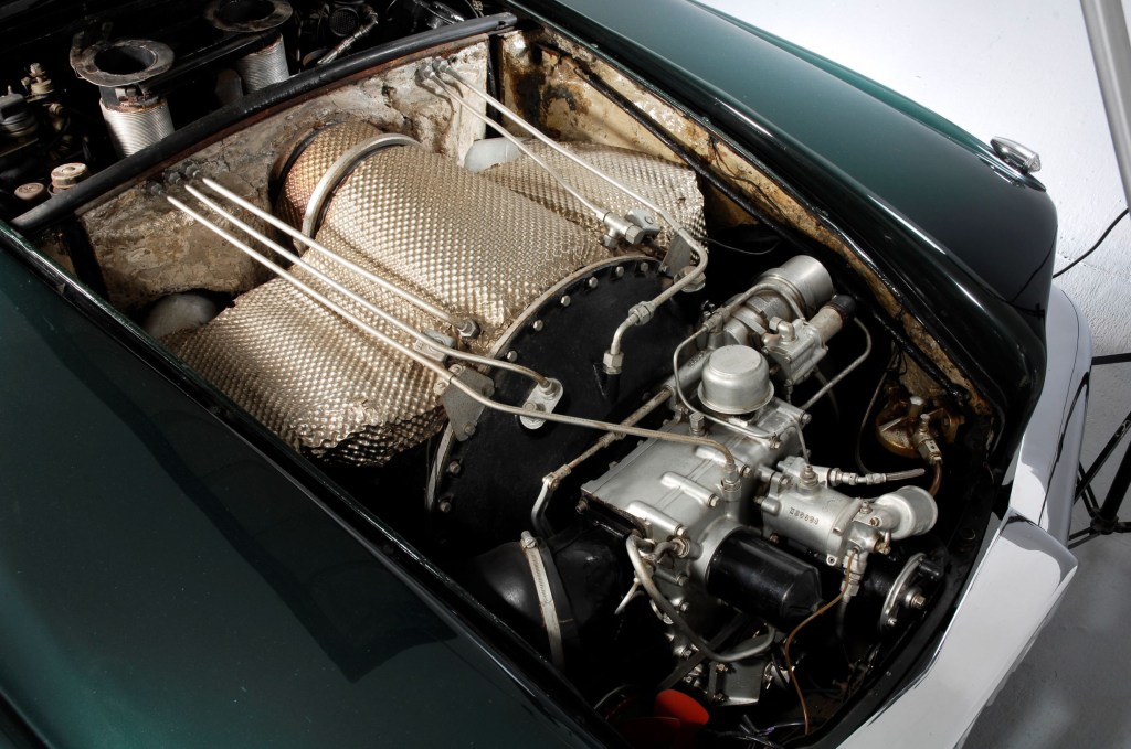 The gas turbine engine under the hood of a green 1961 Rover T4