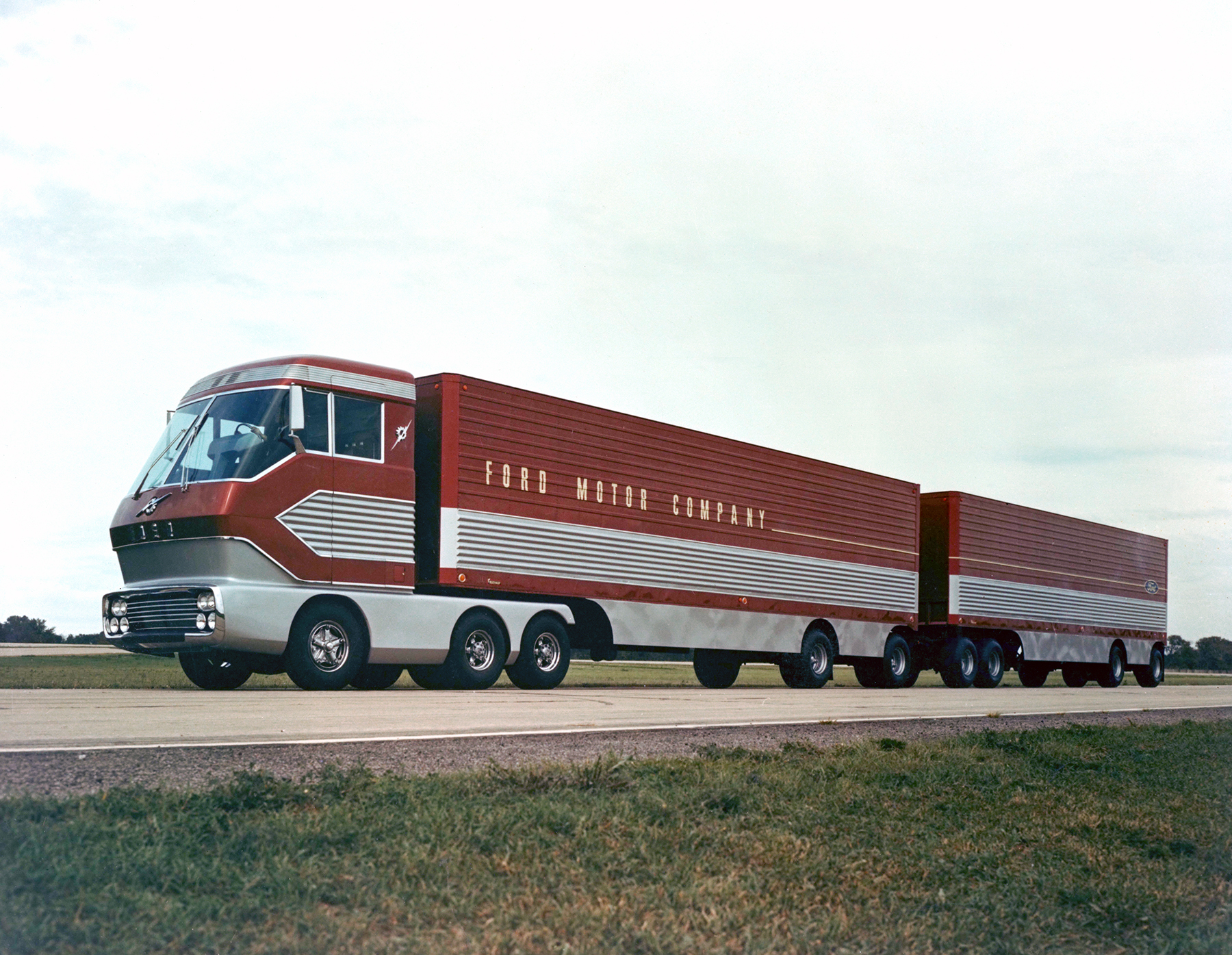 The red-and-silver 1964 Ford 'Big Red' gas turbine truck driving down a highway