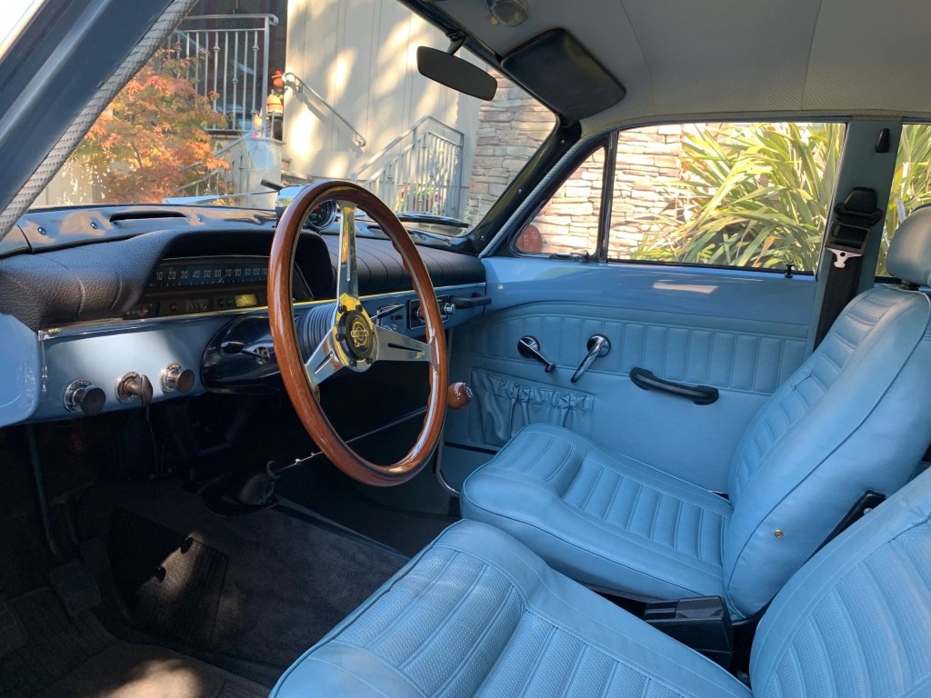 The blue-leather-upholstered front seats and dashboard of a 1967 Volvo Amazon 122S