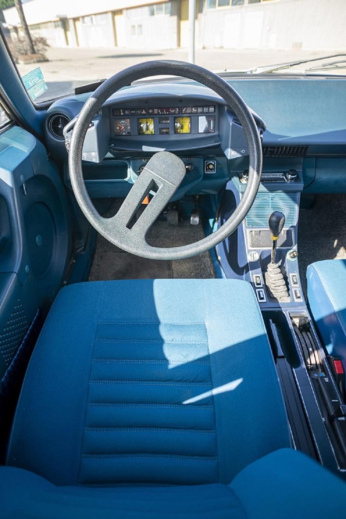 The blue driver's seat and gauge-cluster view of a 1975 Citroen CX 2000
