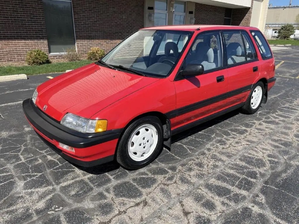A red 1991 Honda Civic 4WD Wagon in a parking lot