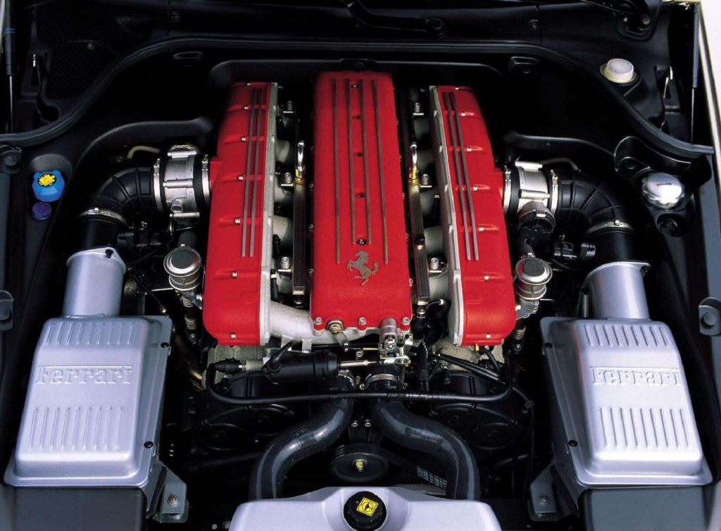 The red-covered 5.7-liter V12 in the engine bay of a 2004 Ferrari 612 Scaglietti