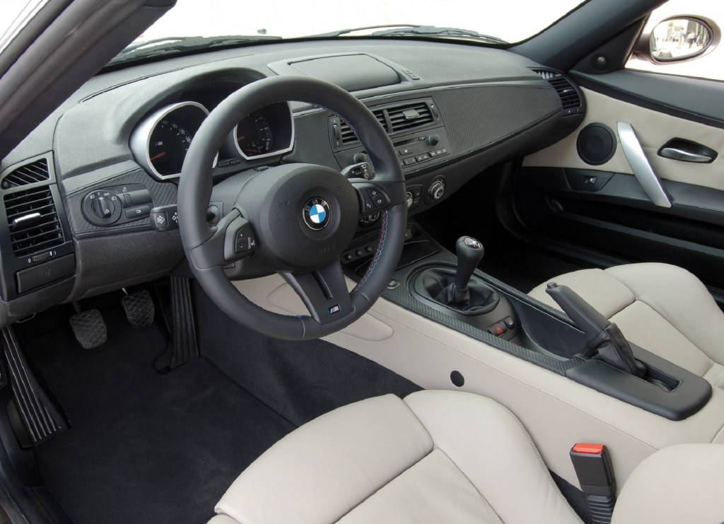 The white-leather-upholstered seats and carbon-fiber-trimmed dashboard of a 2006 BMW Z4 M Coupe