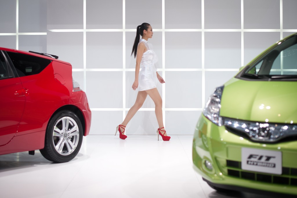 One of the best used cars, the 2012 Honda Fit hatchback, in red and green on display