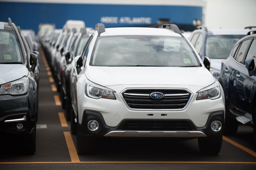 a parking lot full of 2018 Subaru Outback SUVs. Consumer Reports named this model one of the most reliable SUVs of 2018