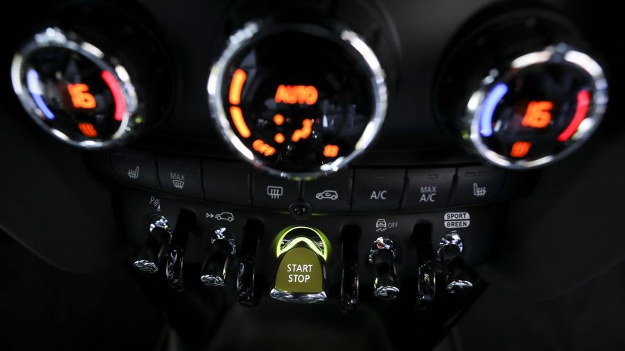 A close-up of the 2020 Mini Cooper SE's dashboard focusing on the push-button start ignition switch