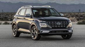 The 2022 Hyundai Venue parked in front of mountains