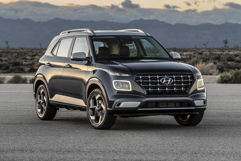 The 2022 Hyundai Venue parked in front of mountains