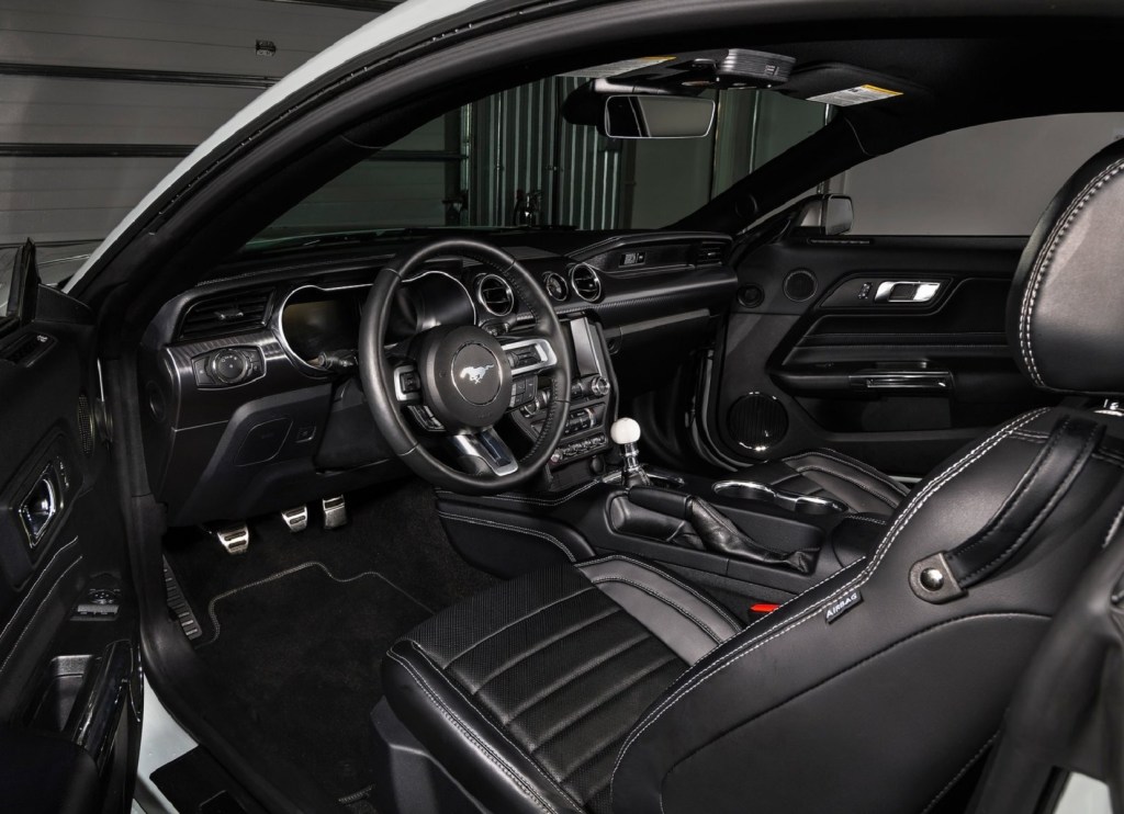 The black interior of a 2021 Ford Mustang Mach 1 with a manual