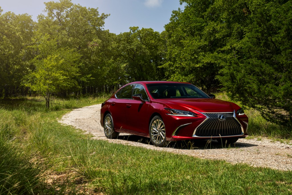 a shot of the 2021 Lexus ES 250 driving on a dirt road