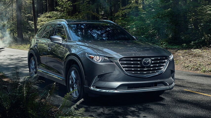The 2021 Mazda CX-9 driving down the road 