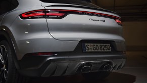 A rear view of a white 2021 Porsche Cayenne GTS luxury SUV
