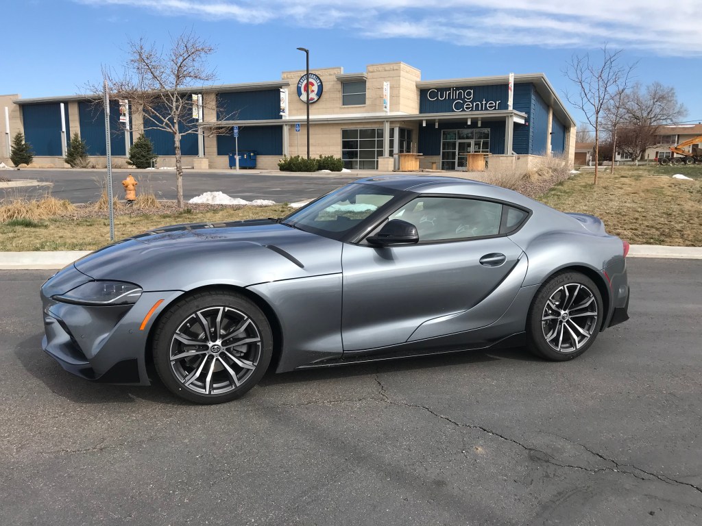 A silver 2021 Toyota Supra sitting in front of the curling center