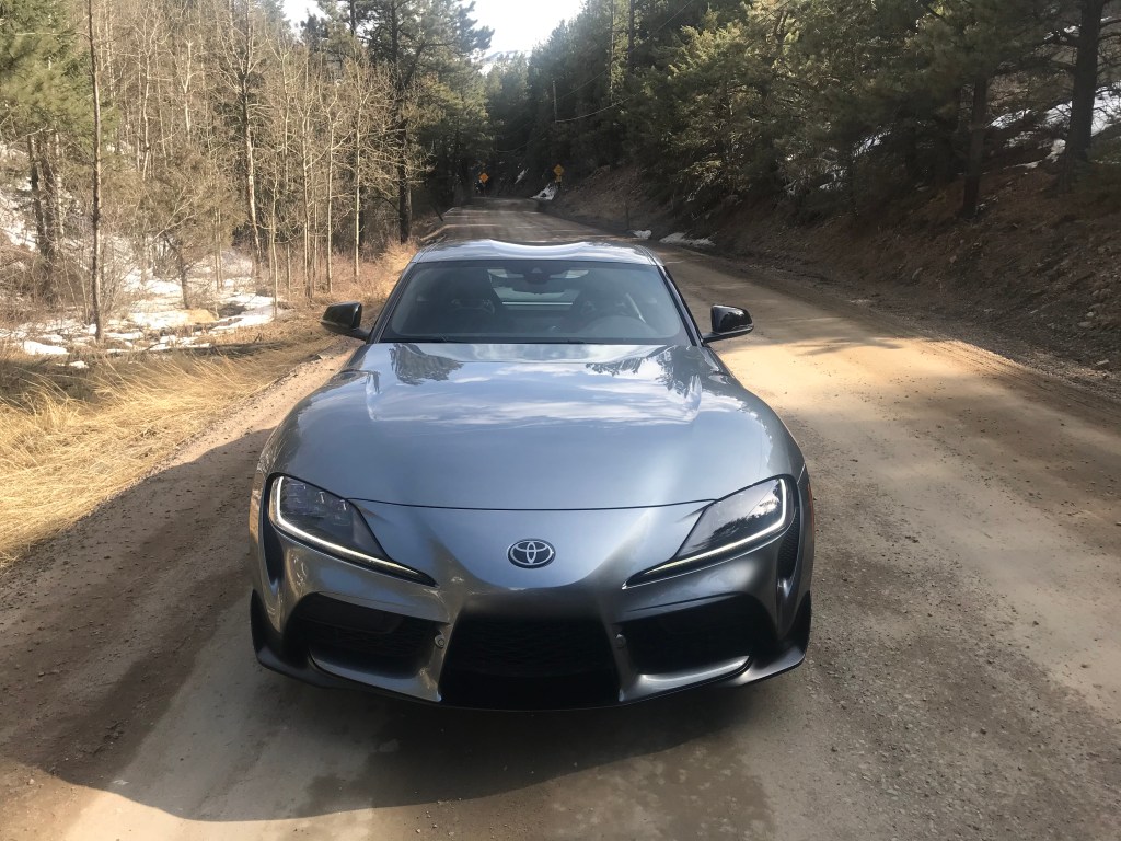 A head-on shot of the 2021 Toyota Supra 2.0  on a dirt road