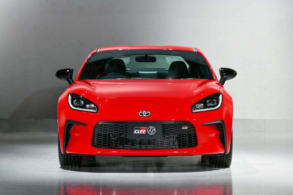 An image of a Toyota GR 86 parked inside of a photo studio.