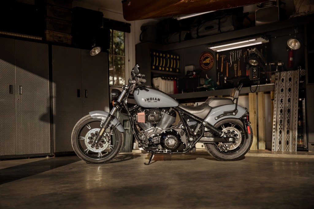 A gray 2022 Indian Chief Dark Horse with Rogue Collection accessories in a garage