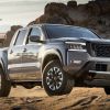 The 2022 Nissan Frontier Pro 4X parked in sand