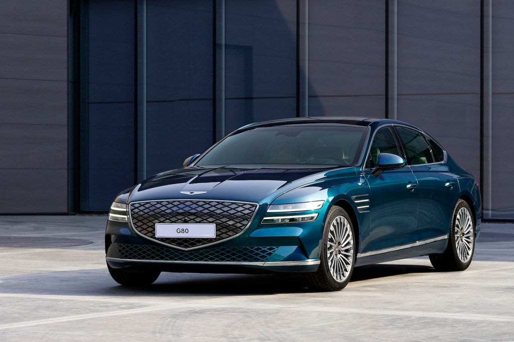 An image of a Genesis Electrified G80 parked outside.
