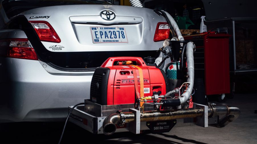 A silver Toyota Camry undergoing emissions tests at an EPA facility