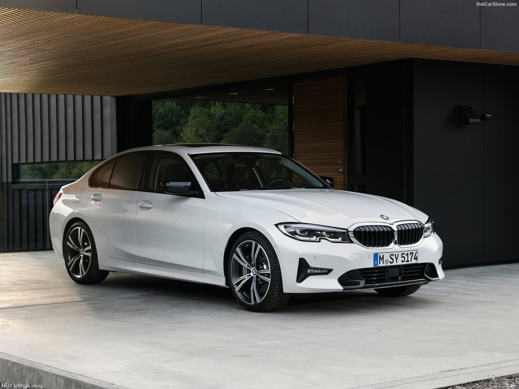 An image of a BMW 3-Series parked outdoors.