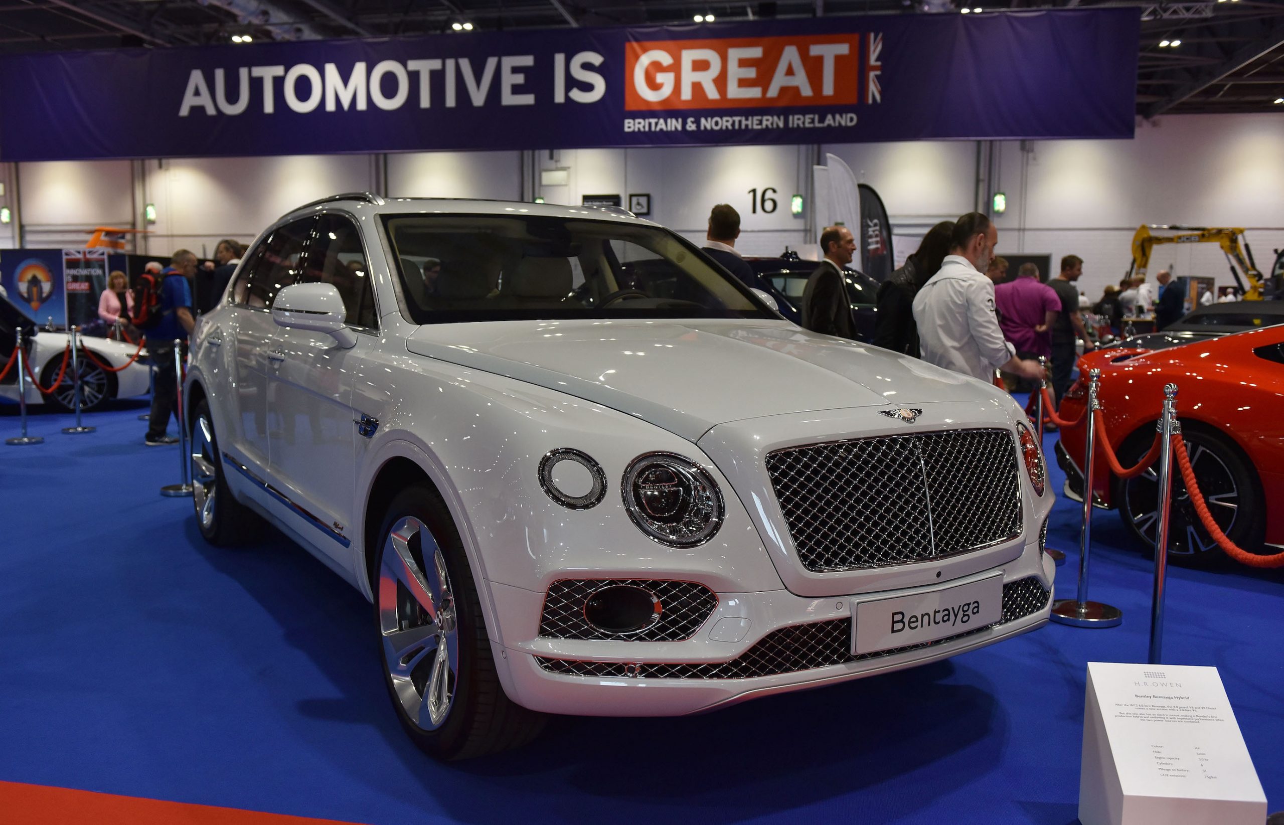 A white Bentley Bentayga Hybrid is displayed during the London Motor Show at ExCel