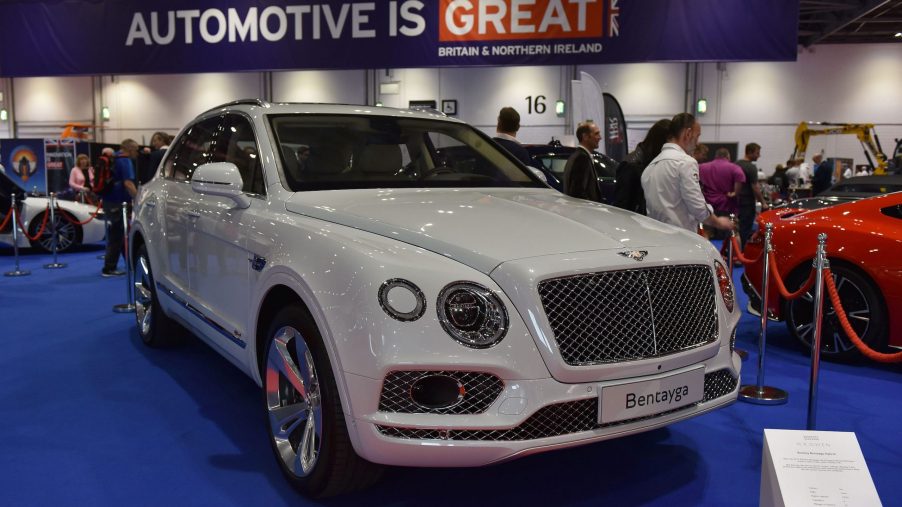 A white Bentley Bentayga Hybrid is displayed during the London Motor Show at ExCel