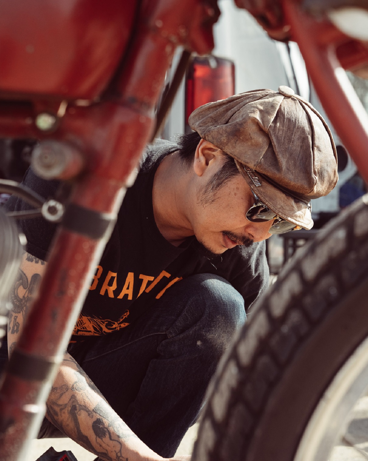Brat Style founder and bike builder Go Takamine with a red vintage Indian