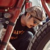 Brat Style founder and bike builder Go Takamine with a red vintage Indian