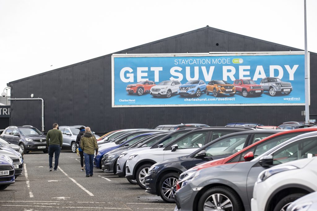 Potential customers walk around Charles Hurst Usedirect used car dealership on Boucher Road in Belfast as restrictions in Northern Ireland ease allowing new and used cars sales