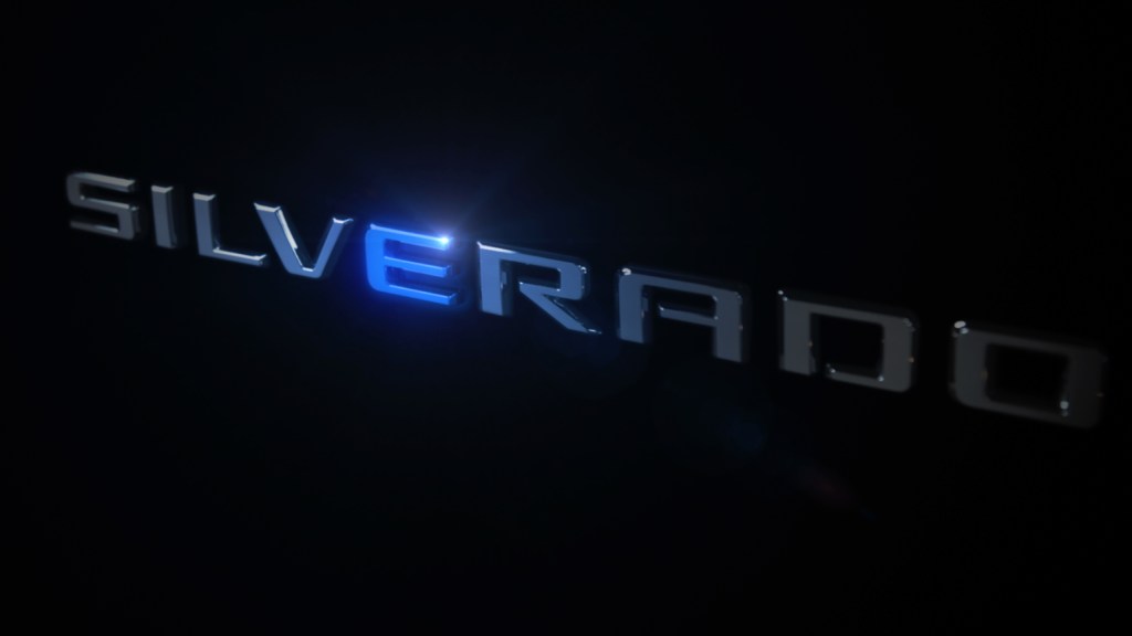 The word Silverado in silver against a black background. The letter E is emphasized in blue.