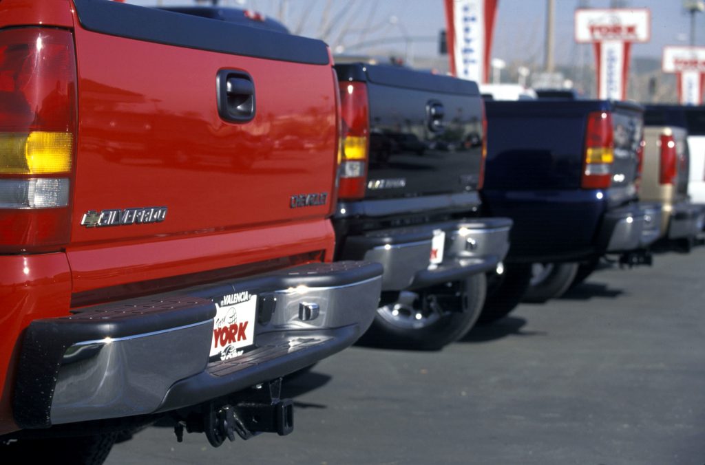 A row of 1999 Chevy Silverados at a dealership