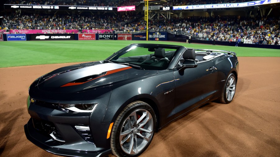 A Chevy Camaro SS sits on a baseball field