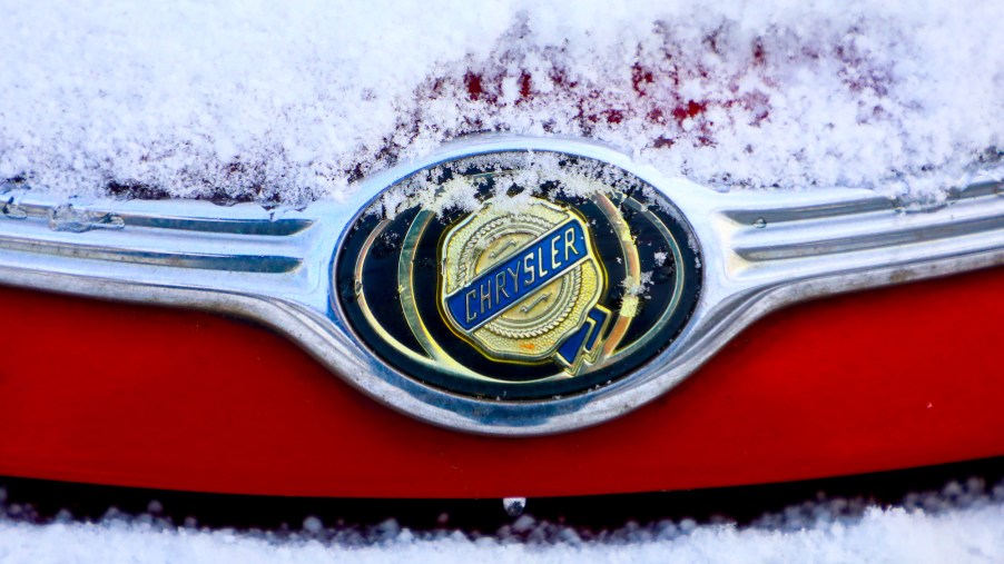 A Chrysler emblem on a red car's hood covered in snow in Krakow, Poland, on January 15, 2021